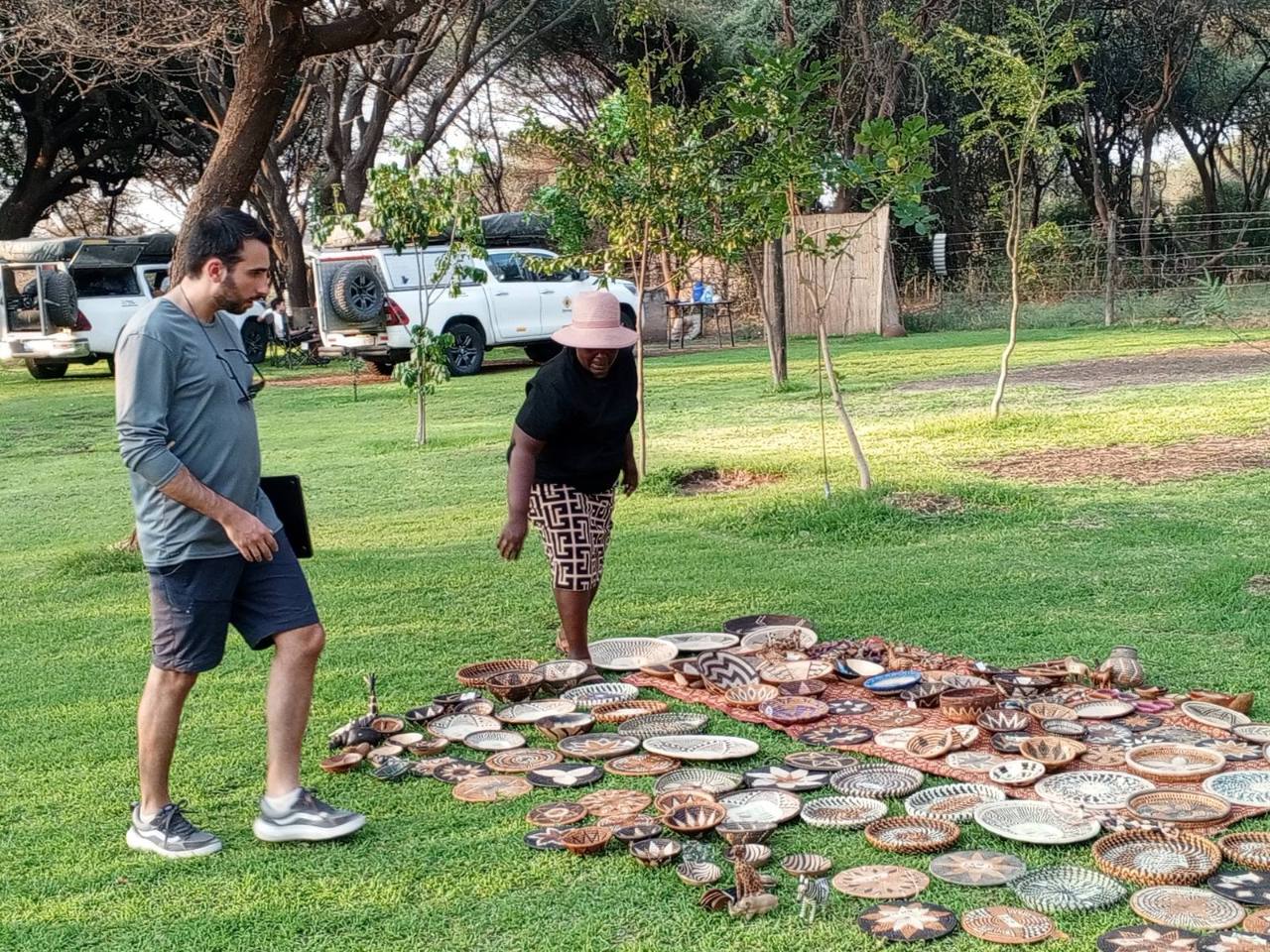 Guests looking at handmade baskets from local weavers